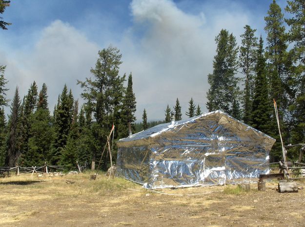 Craig Cabin under fire protection wrap. Photo by Bridger-Teton National Forest.