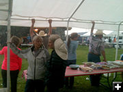 Holding down the canopies. Photo by Dawn Ballou, Pinedale Online.