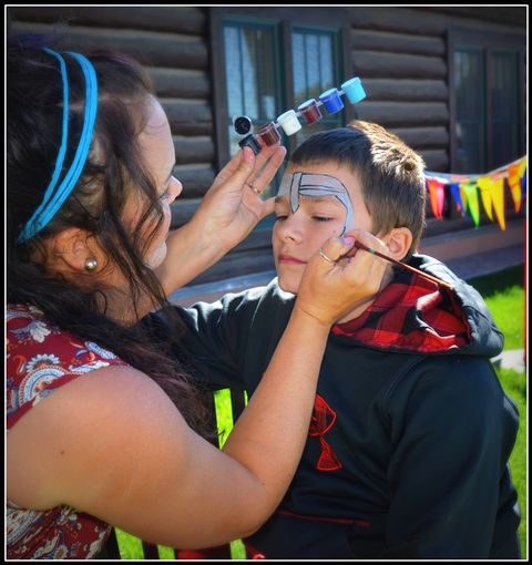 Face Painting by Mae. Photo by Terry Allen.