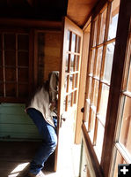 Adjusting door fitting. Photo by Dawn Ballou, Pinedale Online.