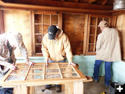 Cleaning and installing windows. Photo by Dawn Ballou, Pinedale Online.