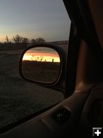 Sunrise in rear view mirror. Photo by Renee' Smythe.