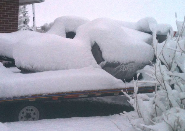 Buried snowmachines. Photo by Dawn Ballou, Pinedale Online.