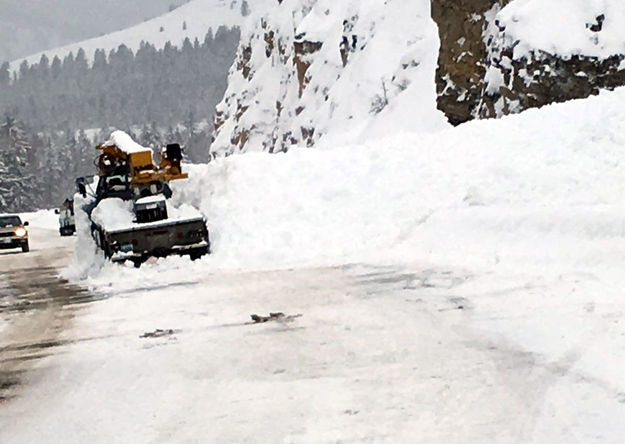 Working to clear the road. Photo by WYDOT.