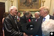 The President gets a cowboy hat. Photo by Wyoming Senator John Barrasso.