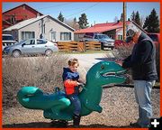 Thomas Rides the Dino. Photo by Terry Allen.