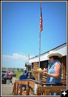 Ann Reads the History. Photo by Terry Allen.