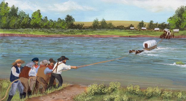 Wagons crossing river in medium water. Photo by Sublette County Historical Society.