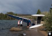 Righting the boat. Photo by Rita Donham.