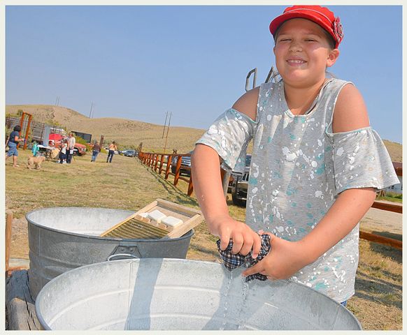 Adri Washes Clothes. Photo by Terry Allen.