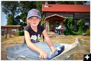 Saige Washing Clothes. Photo by Terry Allen.