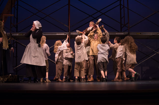 Oliver and the orphans. Photo by Arnold Brokling.