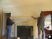Measuring above fireplace. Photo by Jonita Sommers.