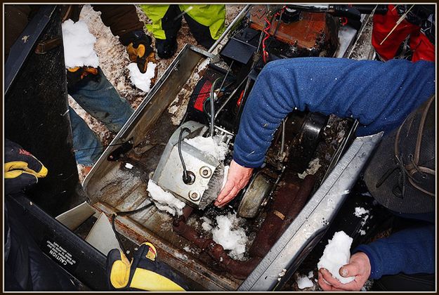 Packing the Engine in Snow. Photo by Terry Allen.