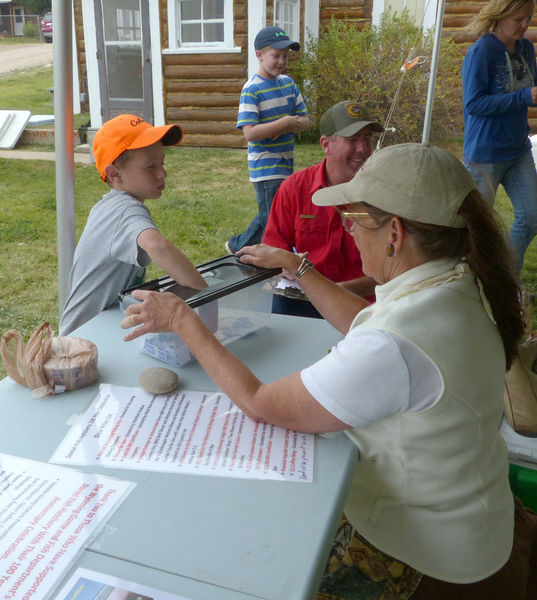 Picking door prize winners. Photo by Dawn Ballou, Pinedale Online.