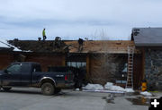 Removing old roof. Photo by Dawn Ballou, Pinedale Online.