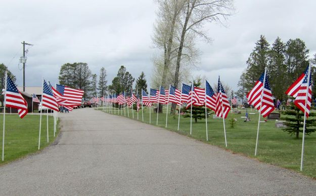 Flag lined road. Photo by Dawn Ballou, Pinedale Online.