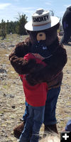 Hug from Smokey. Photo by Clint Gilchrist, Sublette County Historic Preservation Board.