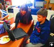 Helping with homework. Photo by Dawn Ballou, Pinedale Online.