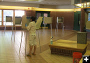 Disinfecting voting booths. Photo by Dawn Ballou, Pinedale Online.