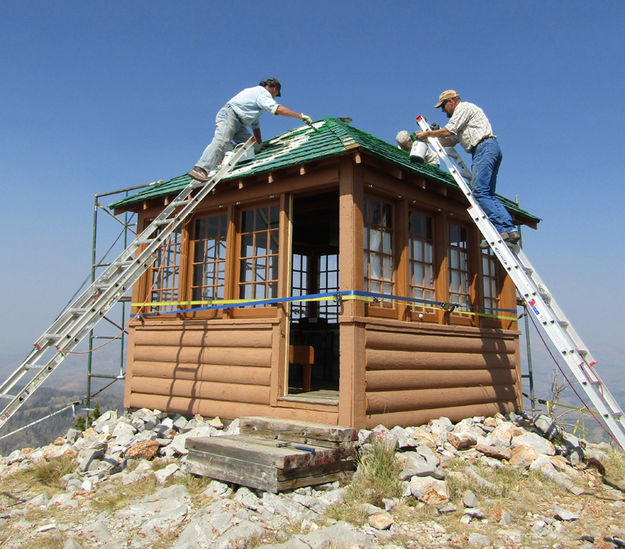 Painting the roof. Photo by Dawn Ballou, Pinedale Online.