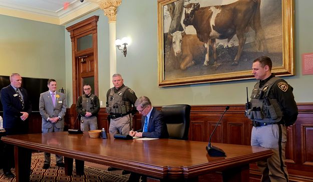 Signing. Photo by Wyoming Highway Patrol.