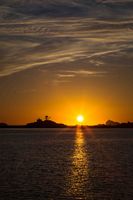 Setting Sun Across Crescent Bay. Photo by Dave Bell.