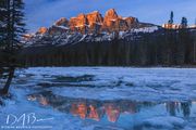 Castle Mountain Reflecting In The Bow River. Photo by Dave Bell.