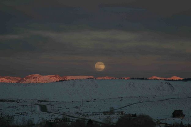 Lit Peaks With Full Moon. Photo by Dave Bell.