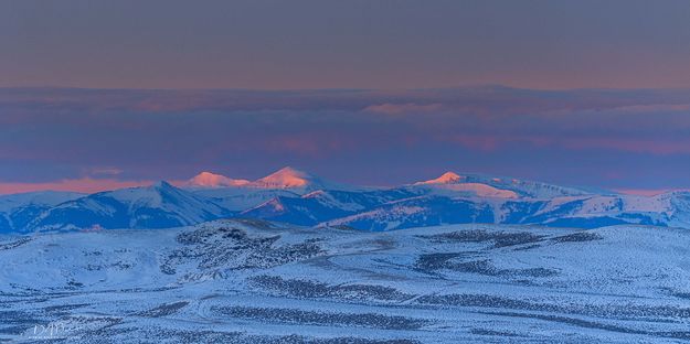 Early Sun On Wyoming Peak And Mt. Coffin. Photo by Dave Bell.