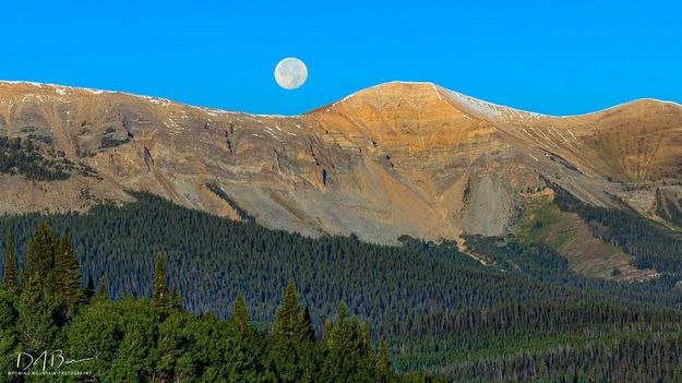 Moon Setting Behind Triple. Photo by Dave Bell.