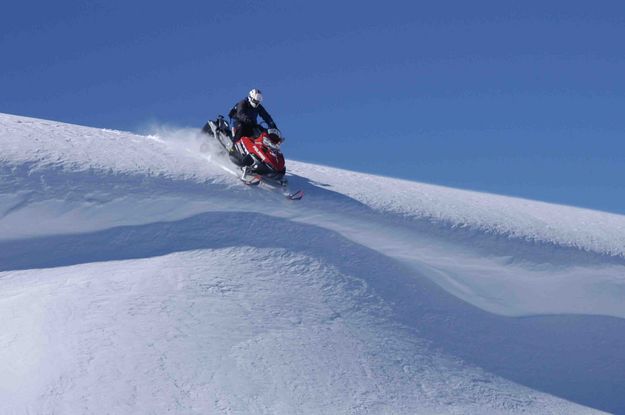 Jumping A Cornice.  Photo Courtesy Arnie. Photo by Dave Bell.