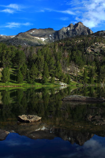 Warbonnet Peak reflected in Big Sandy Lk.. Photo by Fred Pflughoft.