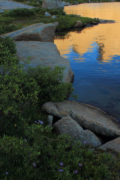 Steeple, Lost Temple Spire & East Temple reflected in Deep Lk.. Photo by Fred Pflughoft.