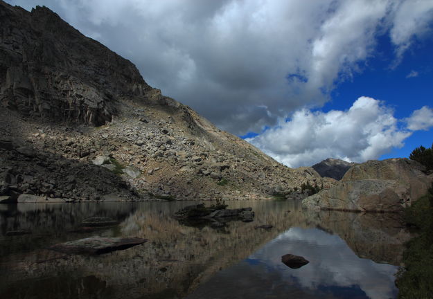 Reflection in Rapid Lk.. Photo by Fred Pflughoft.