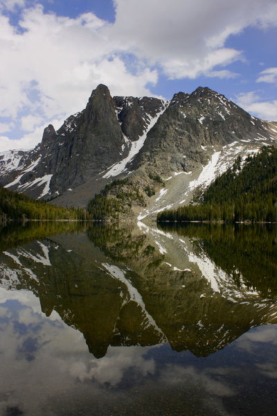 Lost Eagle reflected in Slide Lk.. Photo by Fred Pflughoft.