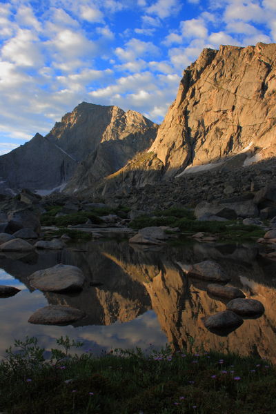 Temple Peak reflected in outlet of Miller Lk.. Photo by Fred Pflughoft.