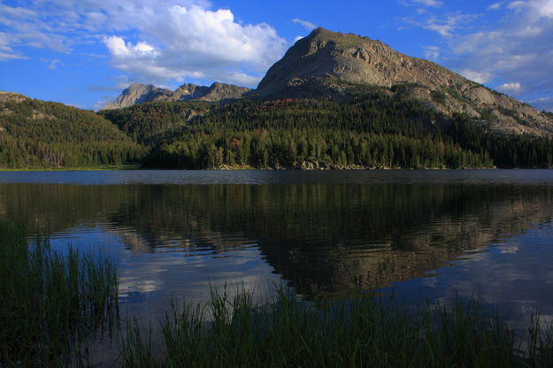 Schiestler Peak reflected in Big Sandy Lk.. Photo by Fred Pflughoft.