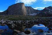 Mount Hooker reflected in outlet of Baptiste Lk.. Photo by Fred Pflughoft.