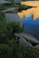 Steeple, Lost Temple Spire & East Temple reflected in Deep Lk.. Photo by Fred Pflughoft.