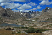 Cumulus Clouds drift over Titcomb Basin. Photo by Fred Pflughoft.