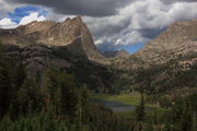 Warbonnet Pk. rises above Big Sandy Lk.. Photo by Fred Pflughoft.