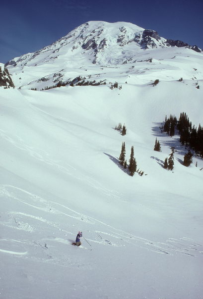 Sue telemarking beneath Mt. Rainier / Washington / circa 1985. Photo by Fred Pflughoft.