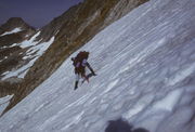 Sue down climbing off the col above Middle Cascade Glacier / Ptarmigan Traverse / Washington / circa 1985. Photo by Fred Pflughoft.