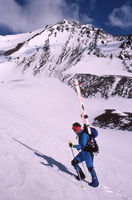Sue climbing the Hayden Glacier for some early morning turns / N. Sister in background / circa 1989. Photo by Fred Pflughoft.