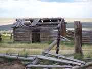 Smaller log cabin in the same location. Photo by Scott Almdale.