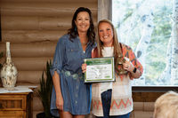 2024 winner Kristy Bartlett presents Ashlee Merriam with her award.