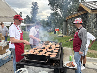 Flipping burgers. Photo by Pinedale Online!