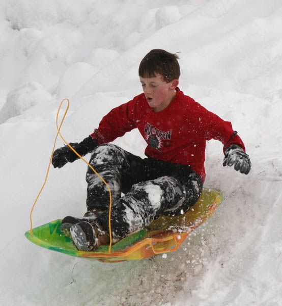 Sledding the Sidelines. Photo by Clint Gilchrist, Pinedale Online.