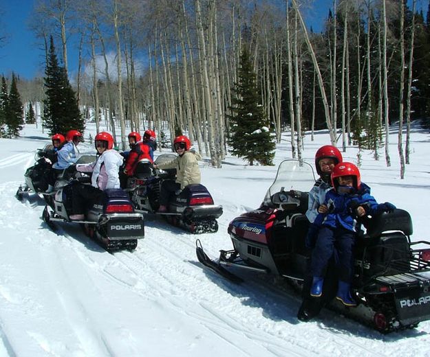 Go on a snowmobile trip!. Photo by Green River Outfitters.